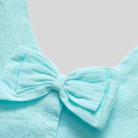 Girls sleeveless light blue top with cute floral print and back bow details-RKFCW214